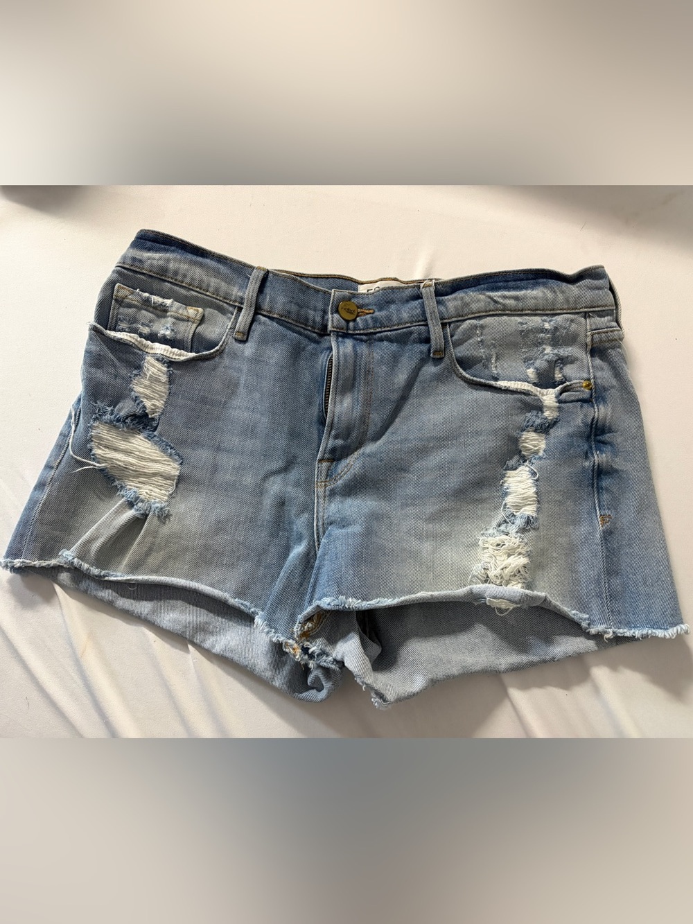 Frame denim “Le Cutoff” distressed summer shorts size 30 in a light wash
